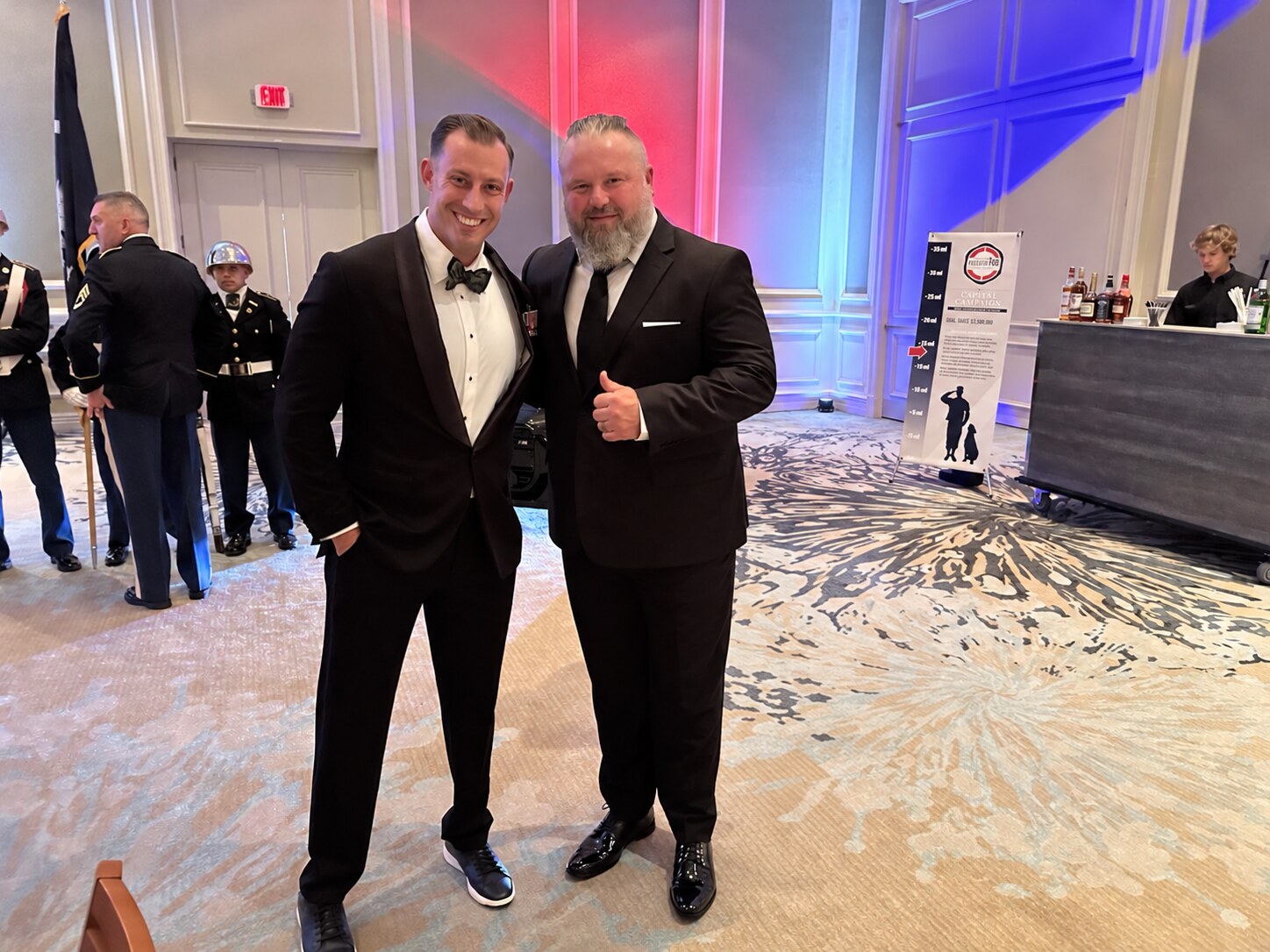 Jonathan Berryhill with a Marine veteran at a formal military event